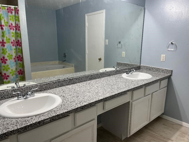 bathroom featuring vanity and separate shower and tub