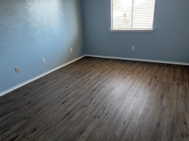 empty room featuring dark hardwood / wood-style floors