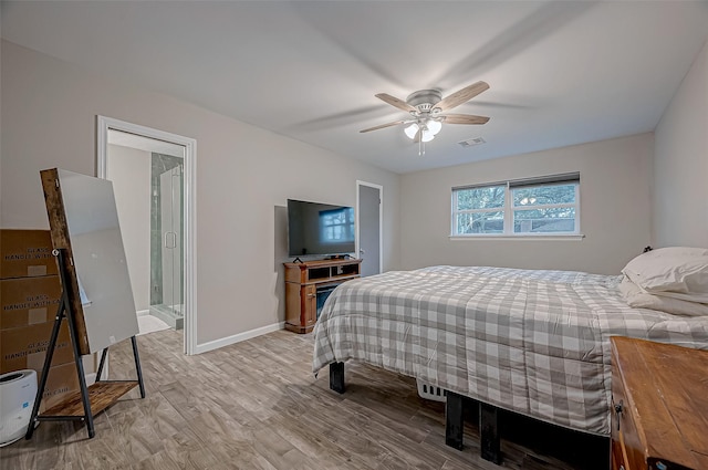 bedroom with ceiling fan, connected bathroom, and light wood-type flooring