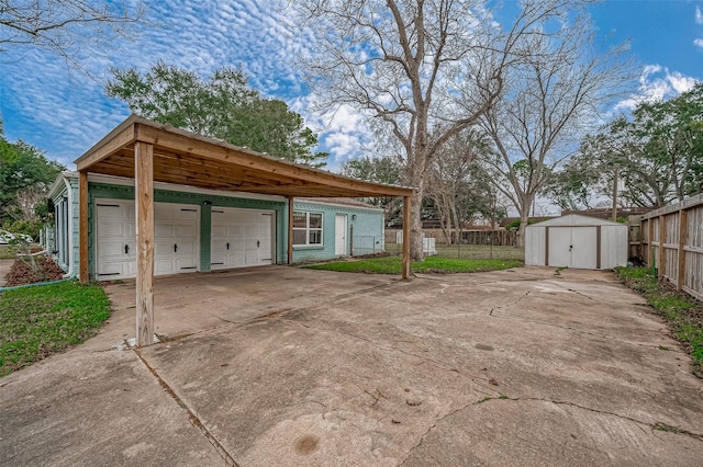 exterior space featuring a garage and a storage unit