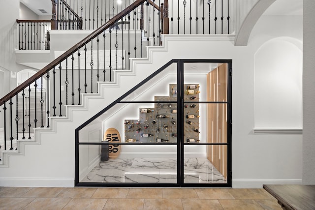 staircase with a high ceiling