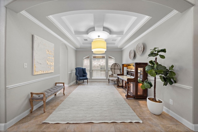 living area featuring ornamental molding and coffered ceiling