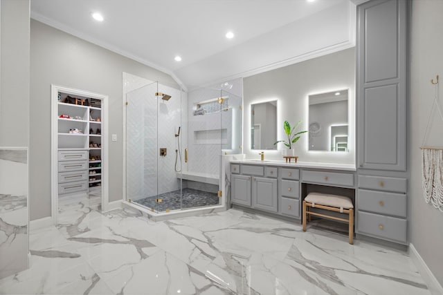 bathroom featuring ornamental molding, vanity, a shower with shower door, and lofted ceiling