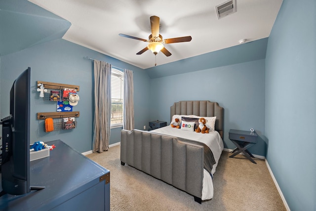 bedroom with lofted ceiling, light carpet, and ceiling fan