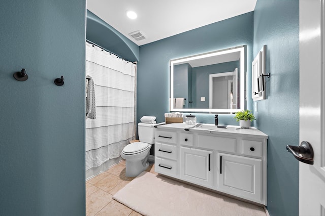 bathroom with vanity, a shower with curtain, tile patterned floors, and toilet