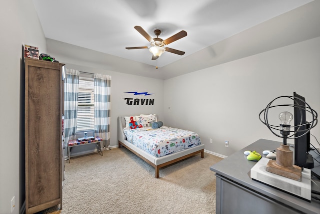 bedroom with ceiling fan and light carpet