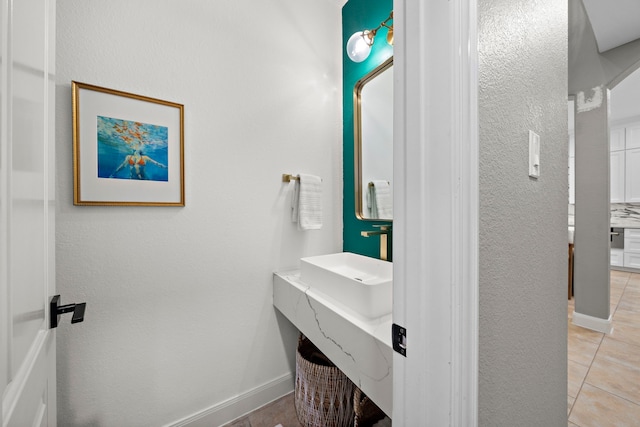 bathroom featuring tile patterned flooring and sink