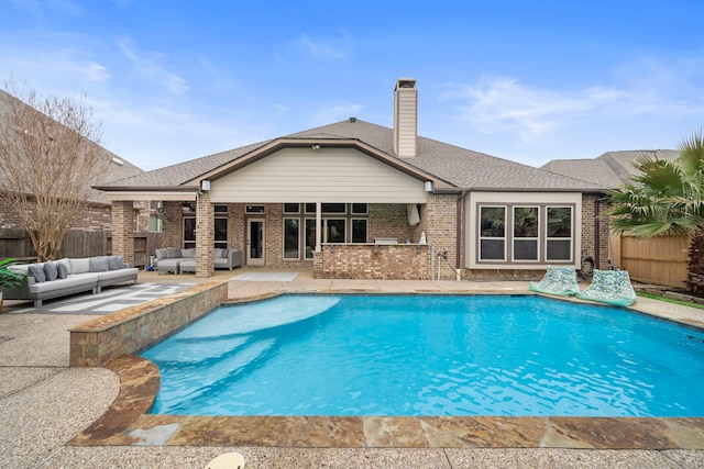 view of pool featuring a bar, a patio area, and outdoor lounge area