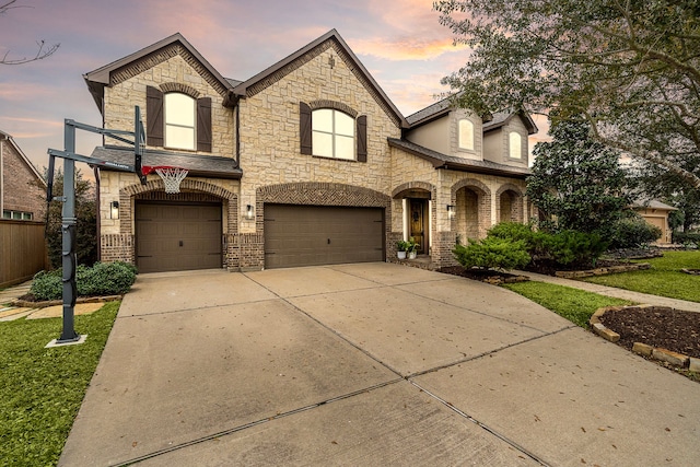 french country home featuring a garage