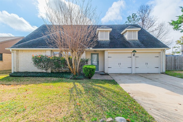 view of front facade with a garage and a front lawn