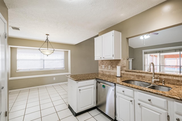 kitchen featuring sink, dark stone countertops, stainless steel dishwasher, kitchen peninsula, and white cabinets