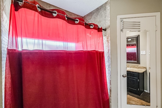 bathroom with vanity and walk in shower