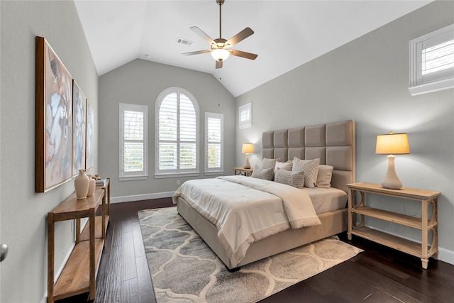 bedroom featuring ceiling fan, lofted ceiling, and dark hardwood / wood-style flooring