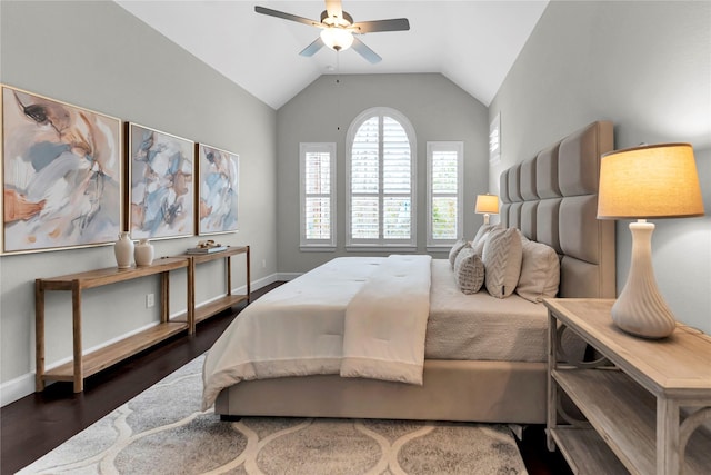 bedroom featuring vaulted ceiling, dark hardwood / wood-style floors, and ceiling fan