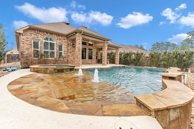 view of swimming pool with an in ground hot tub, pool water feature, ceiling fan, and a patio area