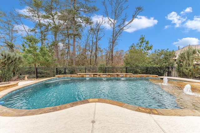 view of swimming pool with pool water feature