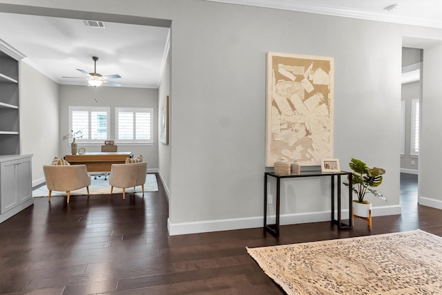 interior space featuring built in features, ornamental molding, dark hardwood / wood-style floors, and ceiling fan