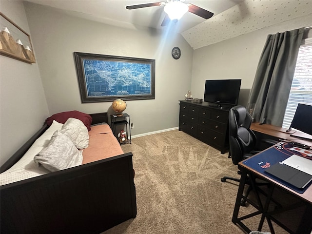 carpeted office space featuring ceiling fan and lofted ceiling