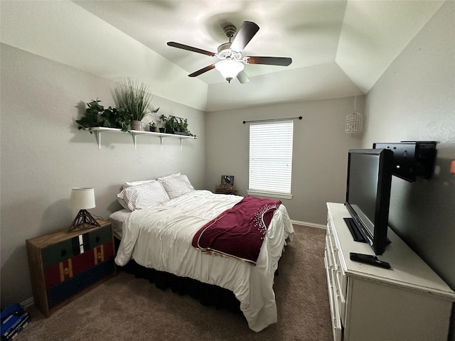 carpeted bedroom with ceiling fan and vaulted ceiling