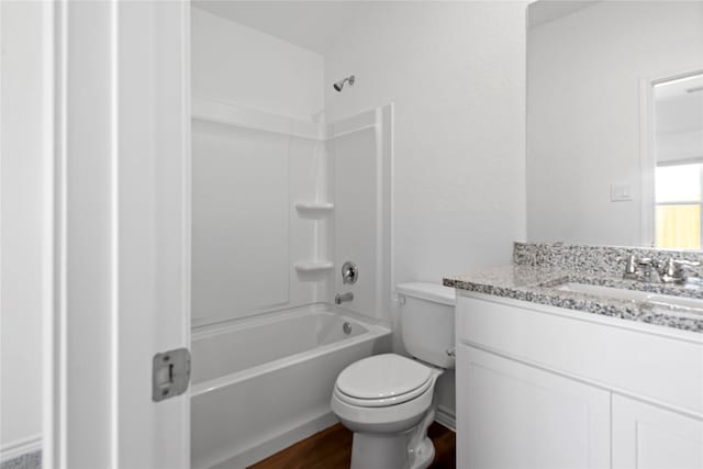 full bathroom featuring toilet, vanity, bathtub / shower combination, and hardwood / wood-style flooring