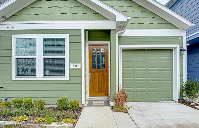 property entrance featuring a garage