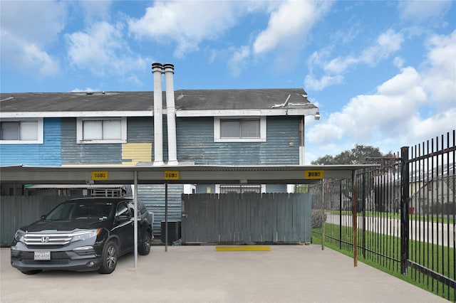 exterior space with a carport