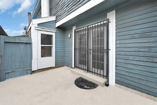 entrance to property featuring a patio area