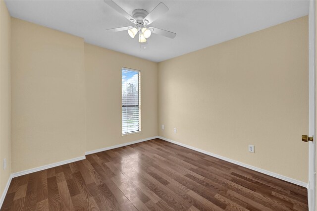 spare room with ceiling fan and wood-type flooring