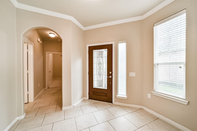 tiled entrance foyer with ornamental molding