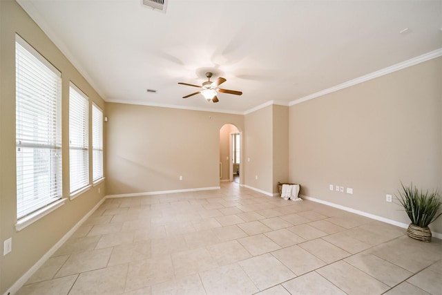 tiled spare room featuring crown molding and ceiling fan