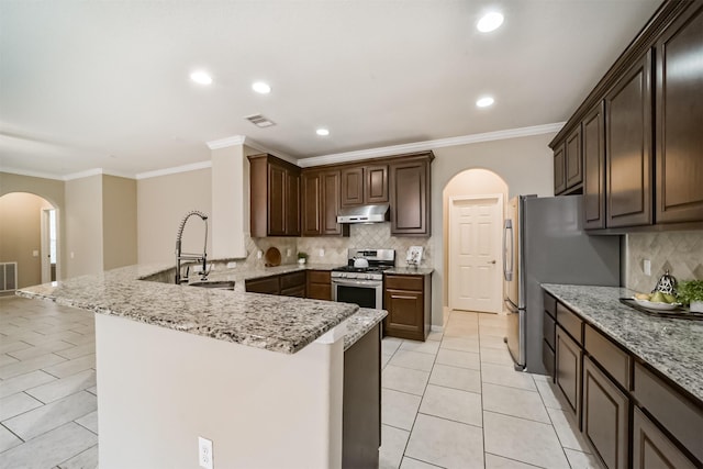 kitchen with dark brown cabinetry, sink, crown molding, appliances with stainless steel finishes, and kitchen peninsula