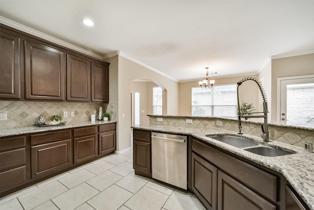 kitchen with dishwasher, sink, ornamental molding, light stone countertops, and dark brown cabinets