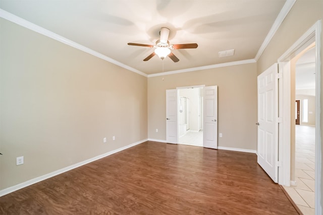 unfurnished bedroom with dark wood-type flooring, ceiling fan, and crown molding