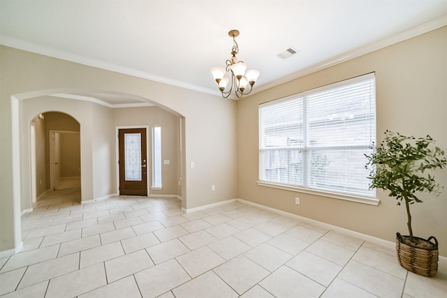 tiled empty room featuring an inviting chandelier and crown molding