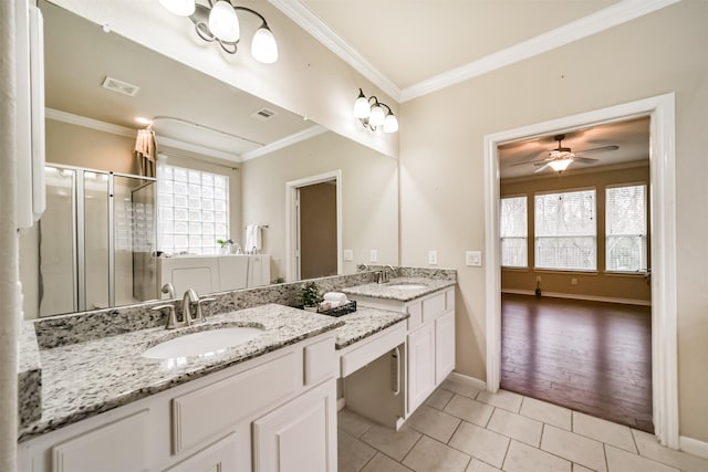 bathroom with ornamental molding, vanity, tile patterned floors, and a shower with shower door