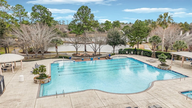 view of swimming pool with a patio area