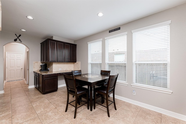 dining area with light tile patterned floors