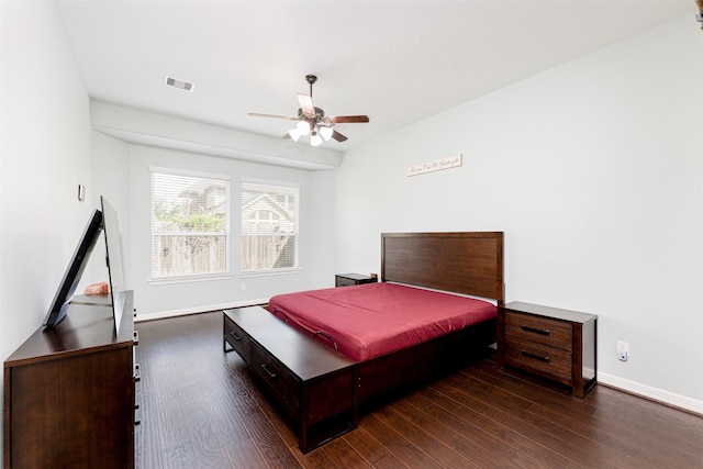 bedroom featuring dark hardwood / wood-style flooring and ceiling fan