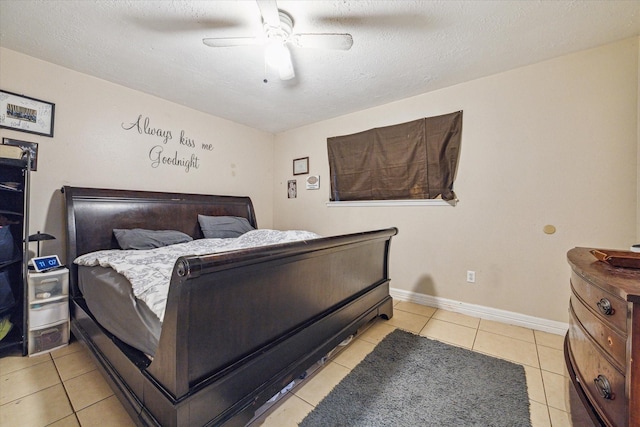 bedroom featuring light tile patterned flooring, a textured ceiling, and ceiling fan