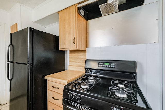 kitchen with extractor fan, decorative backsplash, ornamental molding, and black appliances