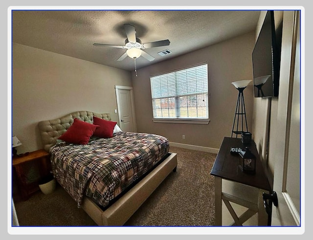 bedroom with dark colored carpet and ceiling fan