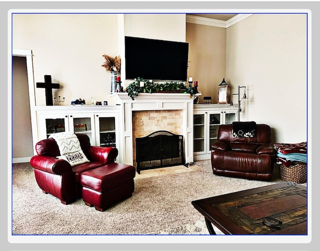 carpeted living room featuring crown molding and a tiled fireplace