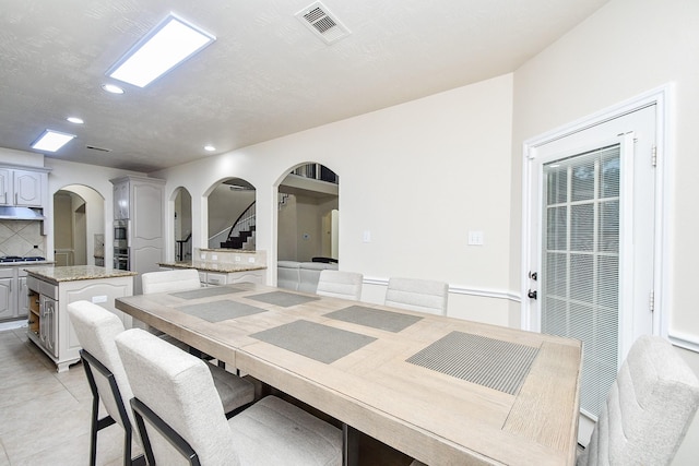 dining area with light tile patterned floors