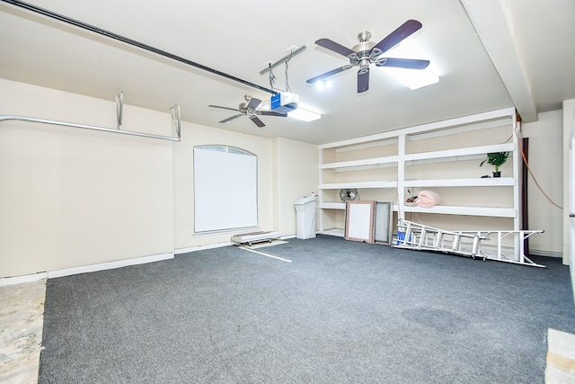 garage featuring a garage door opener and ceiling fan