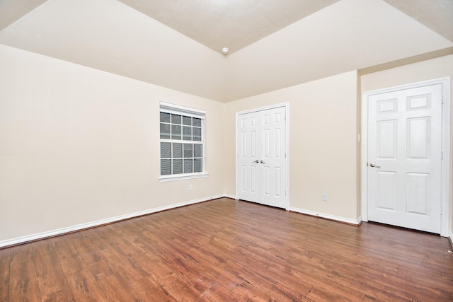 unfurnished bedroom featuring dark wood-type flooring