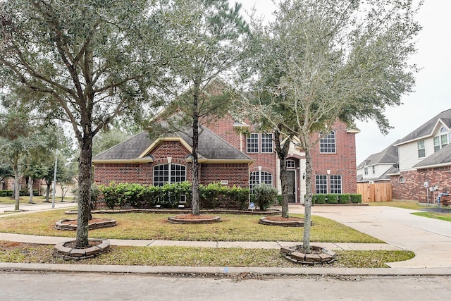 view of property with a front lawn