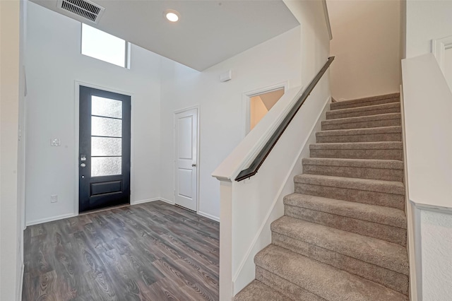 entryway with dark hardwood / wood-style floors