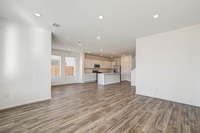 unfurnished living room with hardwood / wood-style flooring