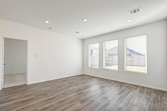 unfurnished room featuring dark hardwood / wood-style flooring