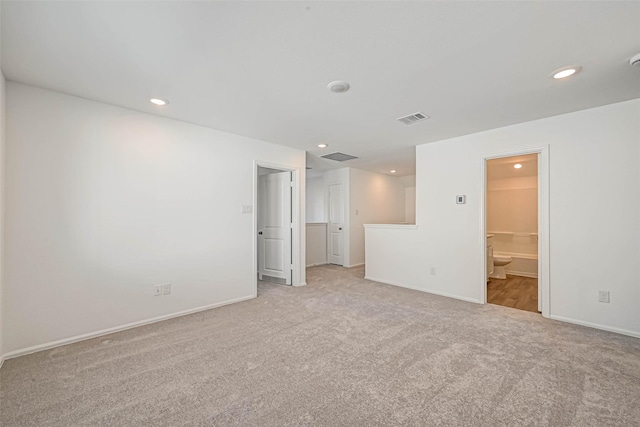 unfurnished room with light colored carpet